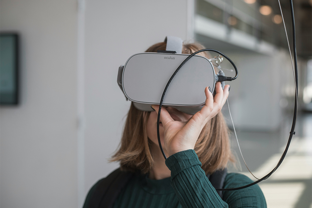 Woman using a virtual reality headset in a modern environment