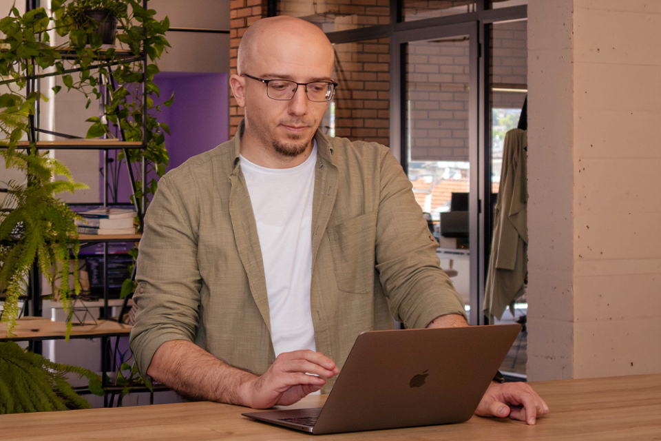 Programmer focused on coding in a modern office environment