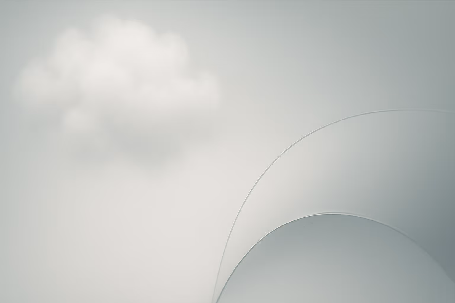 A soft, white cloud floats against a pale background with two faint overlapping curved lines in the lower right corner.