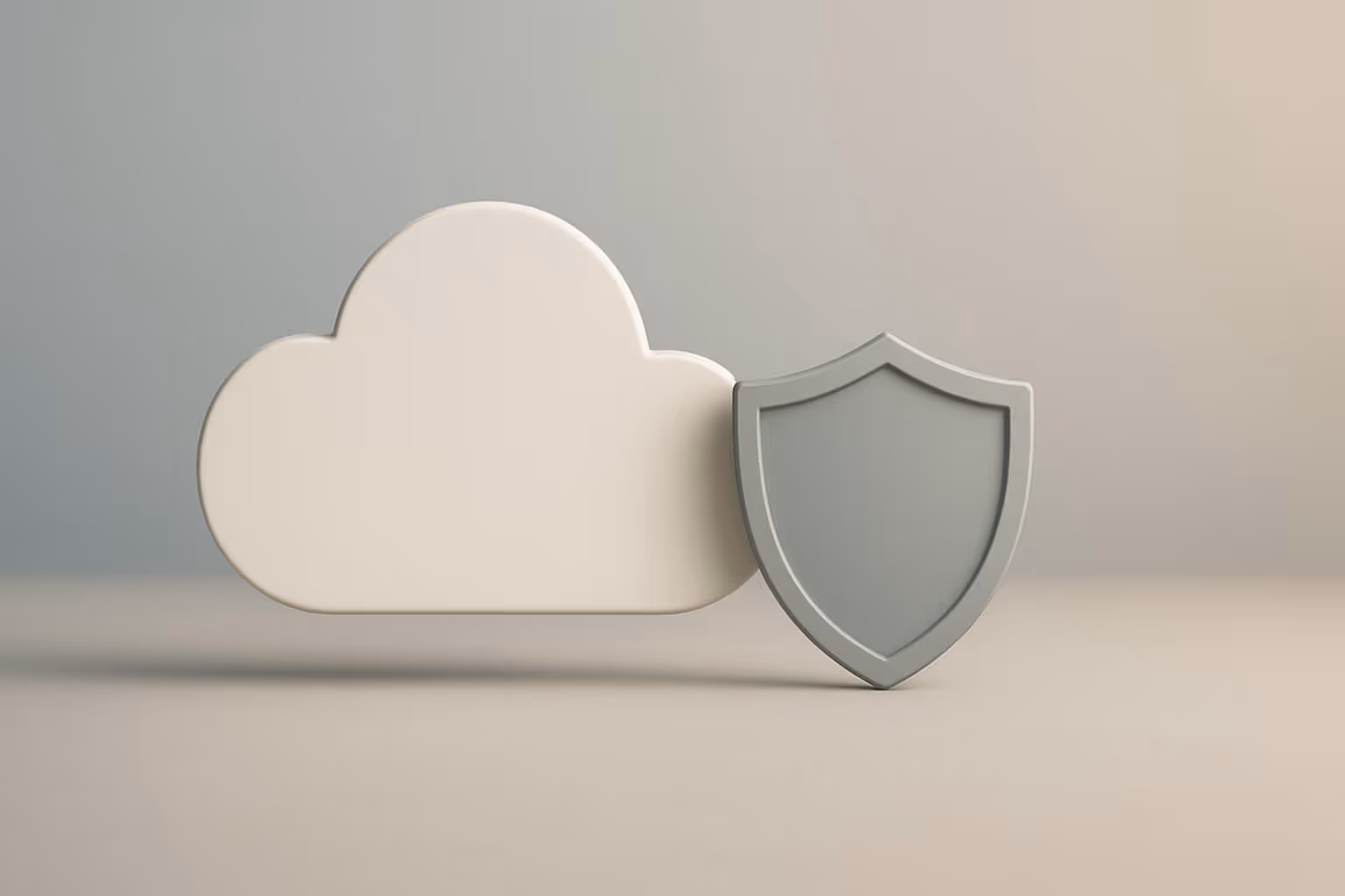 A white cloud shape stands next to a gray shield shape on a neutral background.
