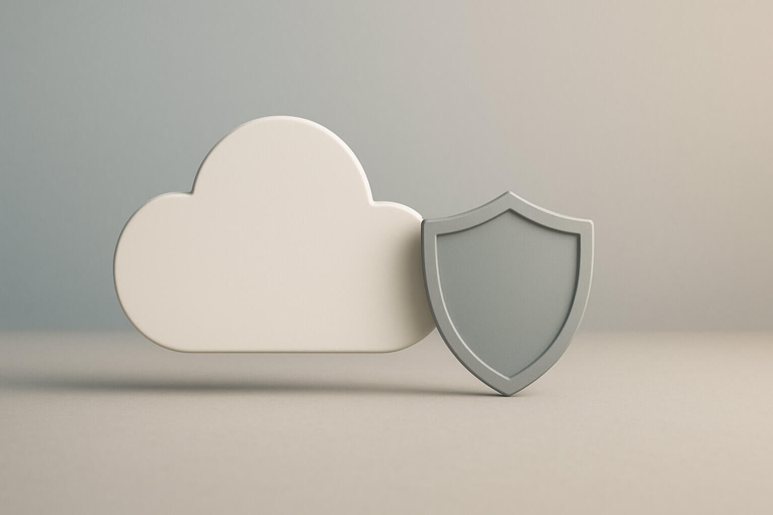 A white cloud shape stands next to a gray shield shape on a neutral background.
