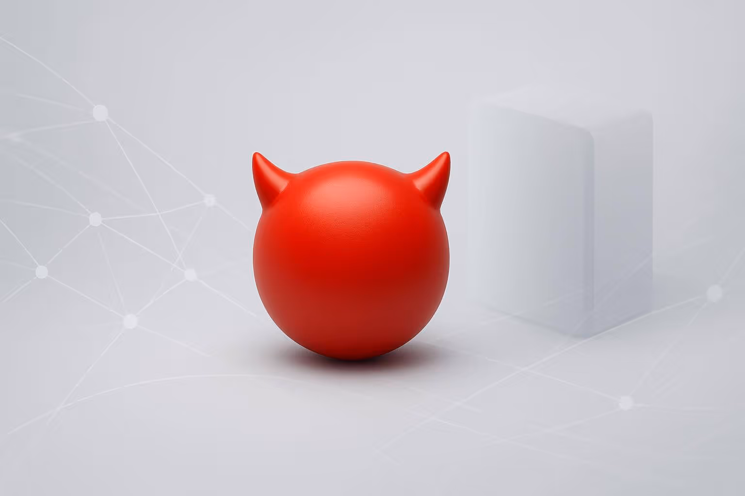 A smooth red sphere with two pointed horns sits beside a translucent white rectangular block on a light background.