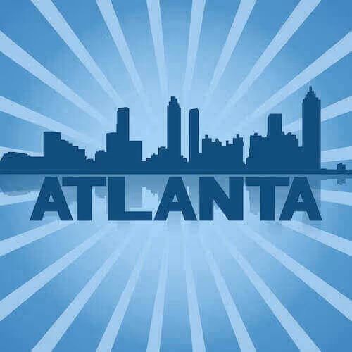 A dark blue city skyline silhouette with large text "ATLANTA" below and light blue rays radiating from the background.