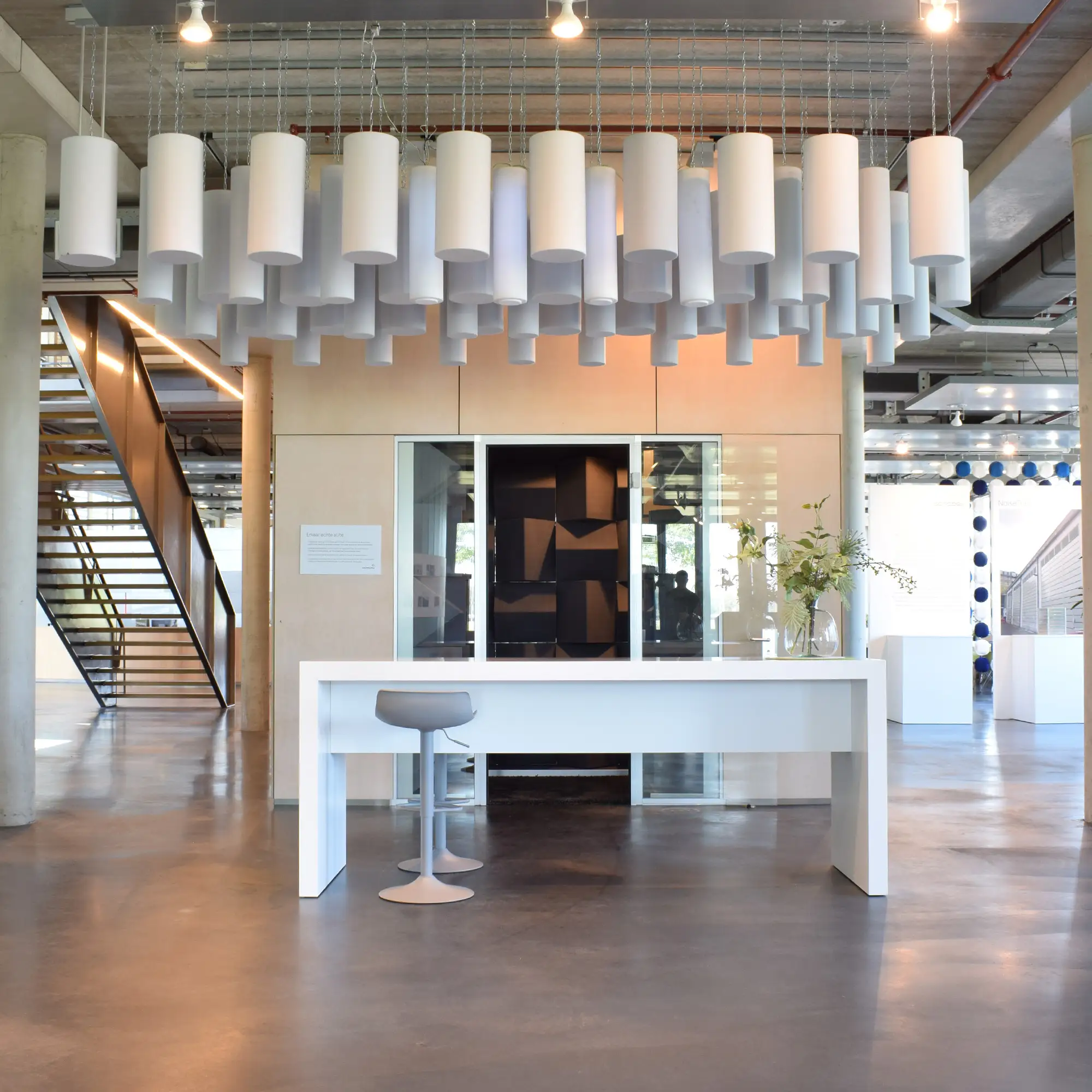 Merford showroom with acoustic ceiling elements and modern interior design.