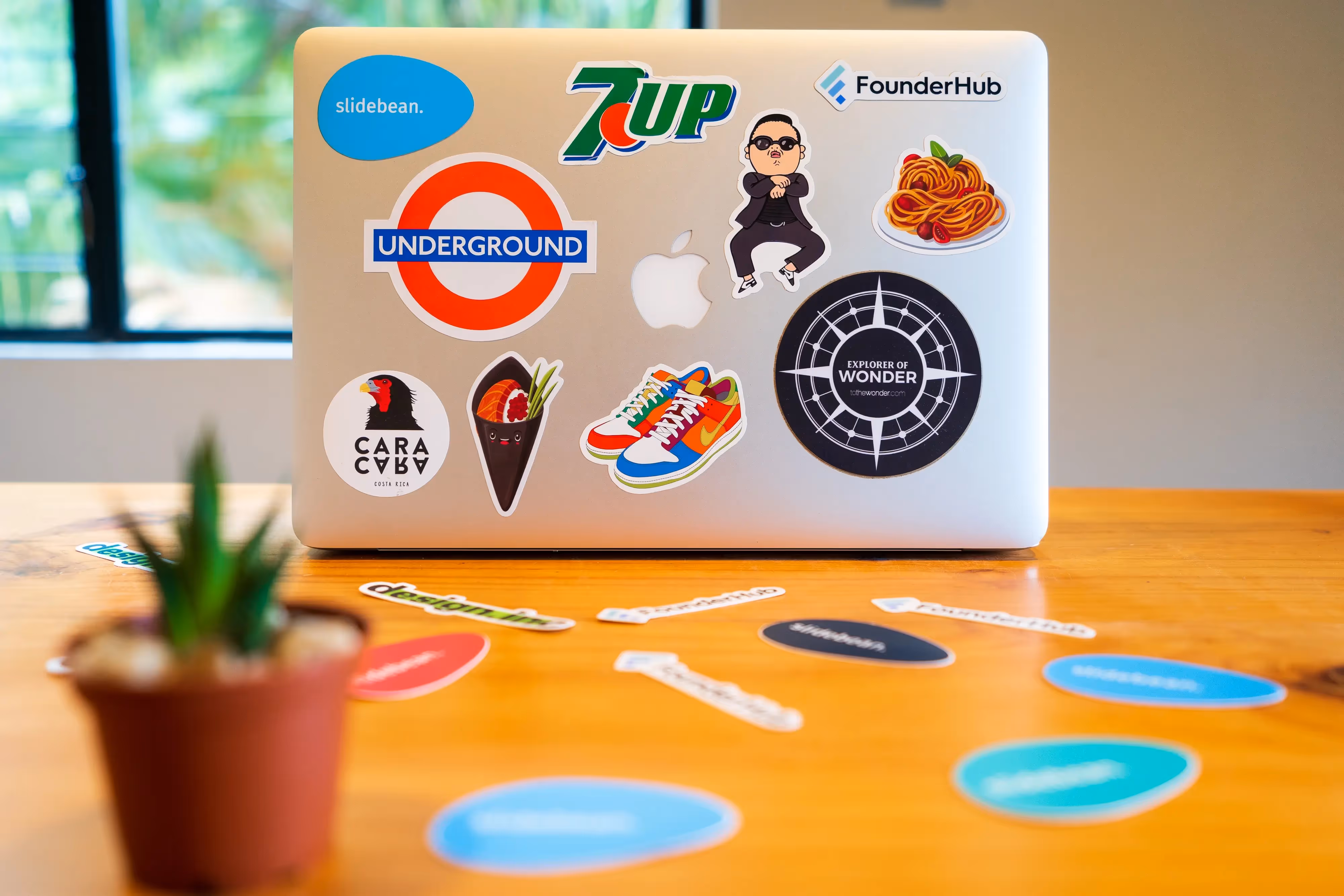 Laptop with assorted brand stickers defining brand identity