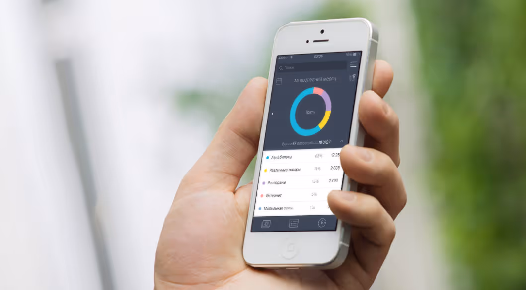 holding phone showing design trends
