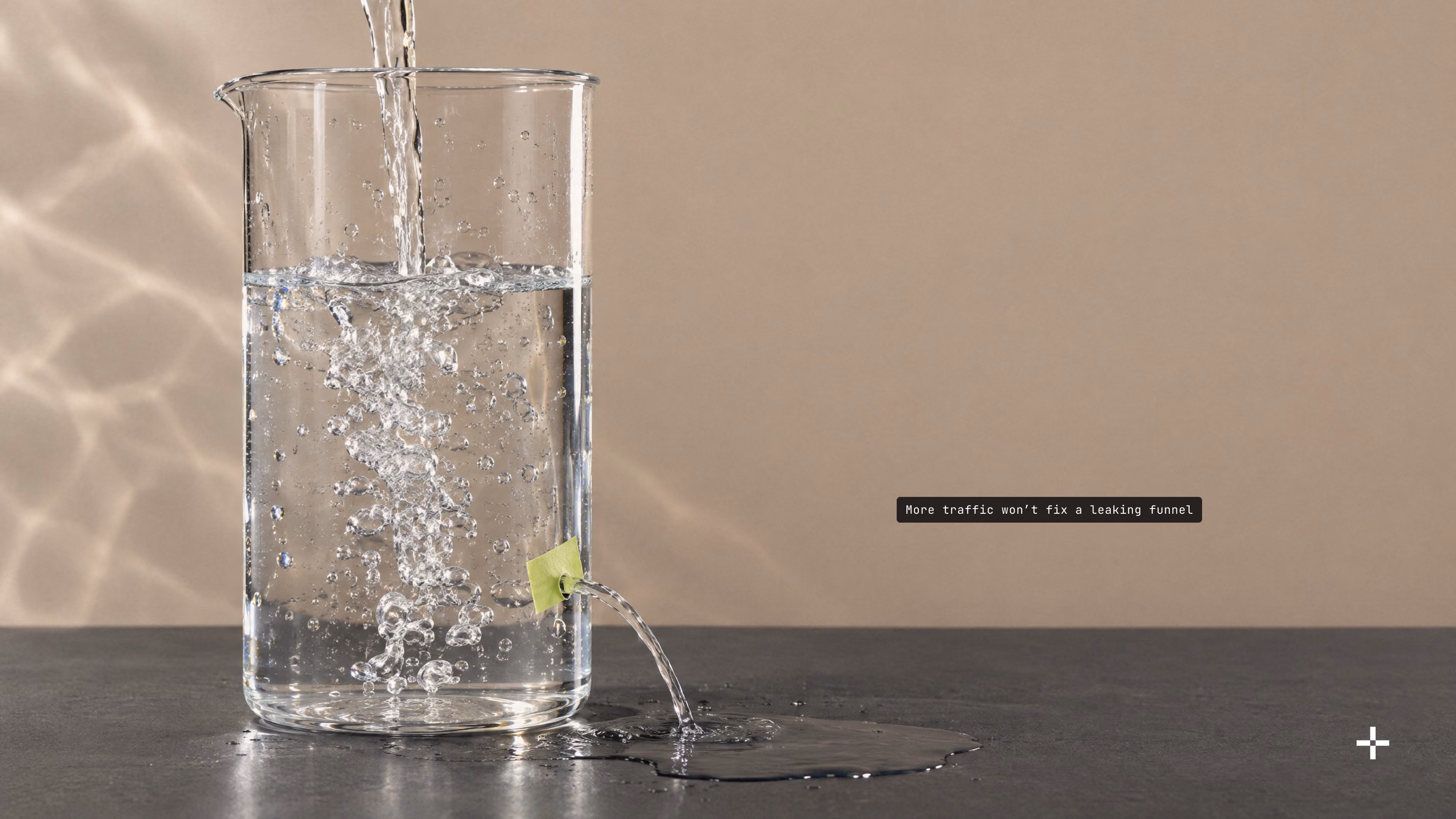 A glass beaker filling with water while it leaks through a hole patched with lime tape, a picture of a leaking conversion funnel