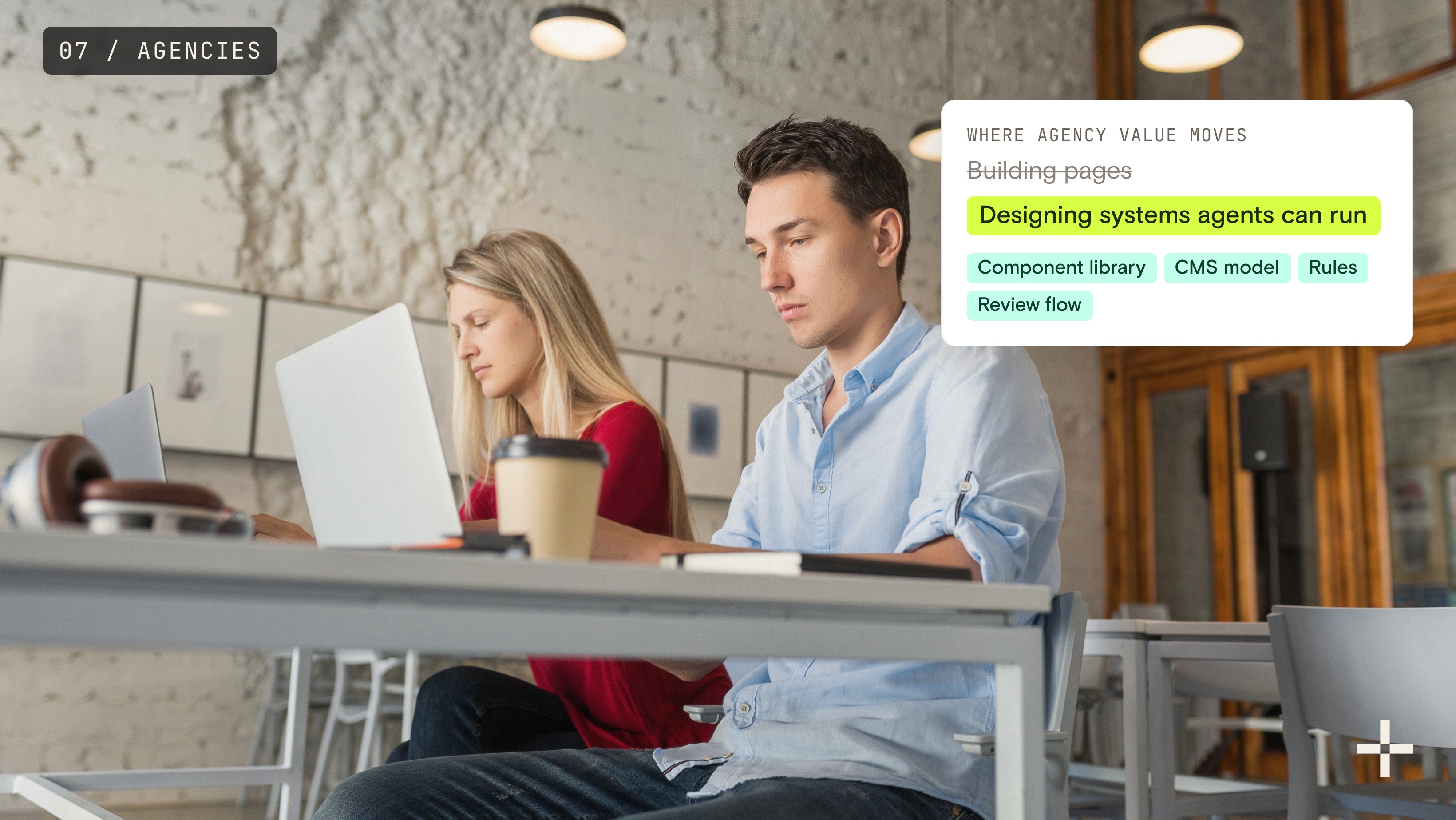 Two people working on laptops with a card showing agency value moving from building pages to designing systems agents can run