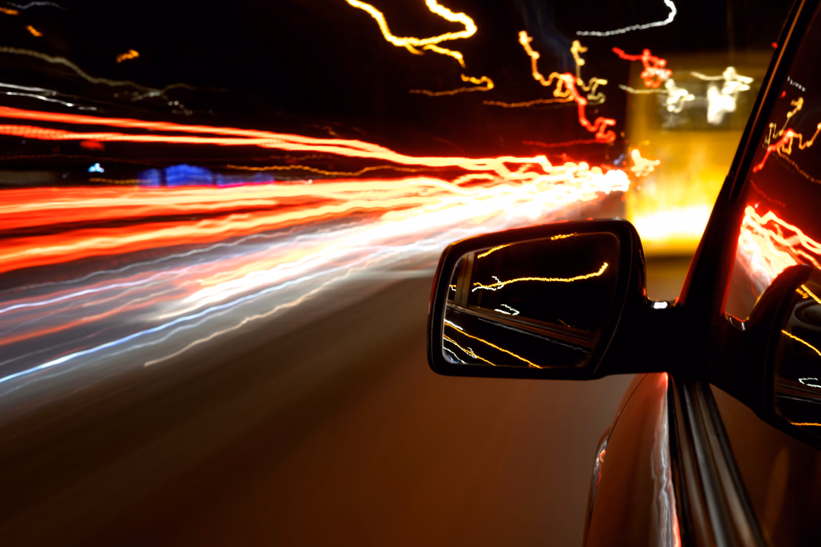 low light exposure photo of lights and car