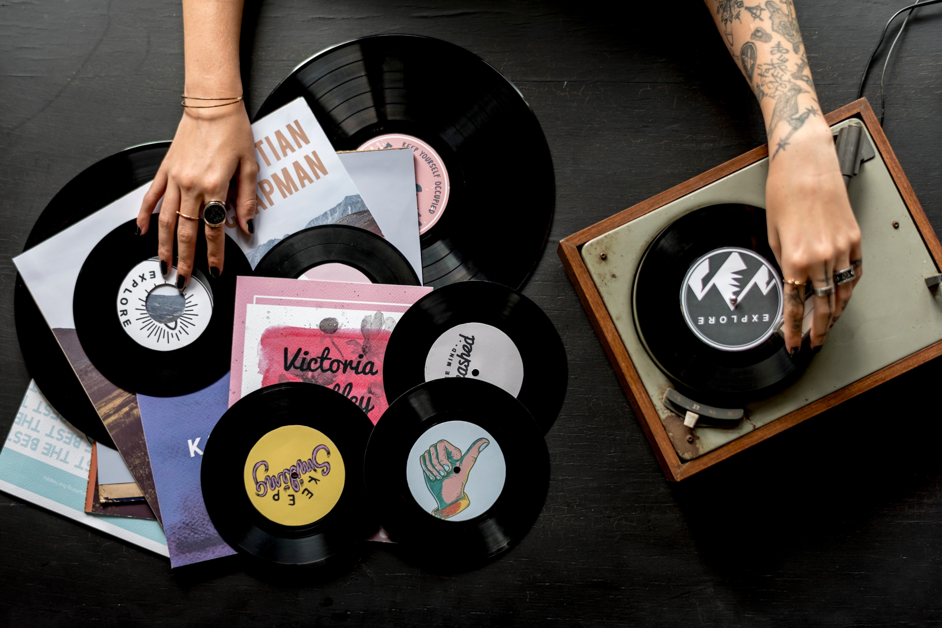 Tattoo woman with music vinyl record disc with player