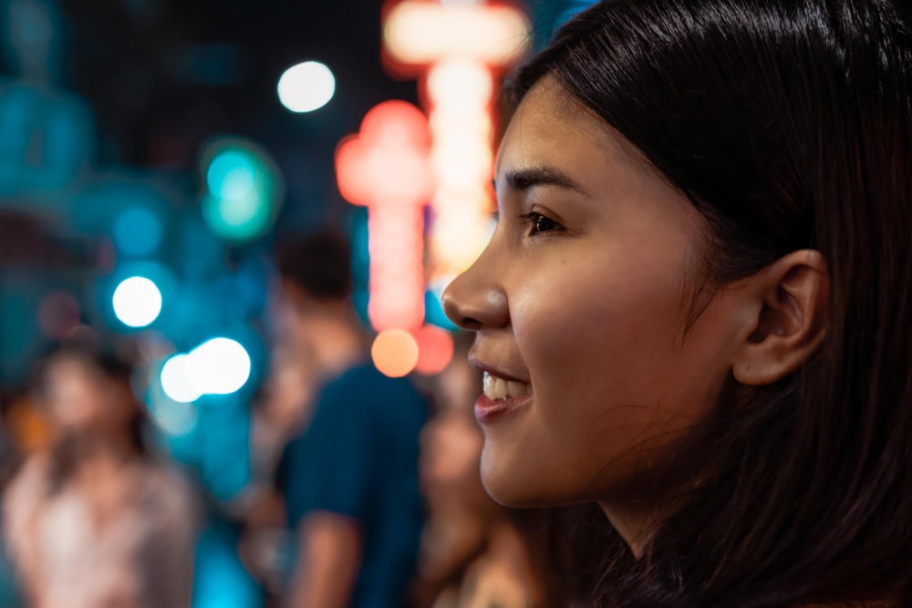 Lifestyle of night in the city with young woman