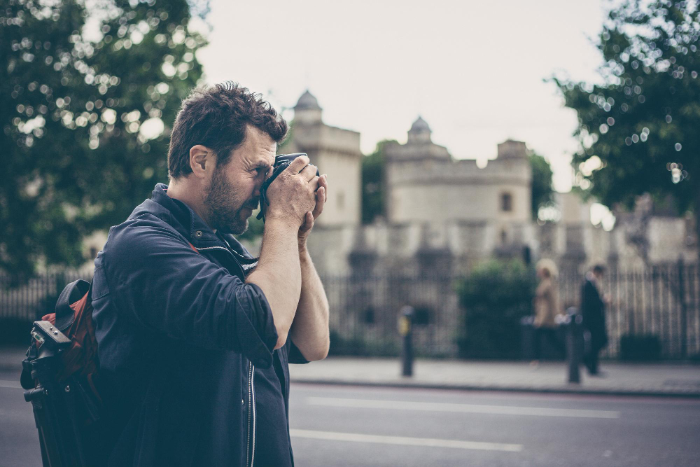 male photographer in city
