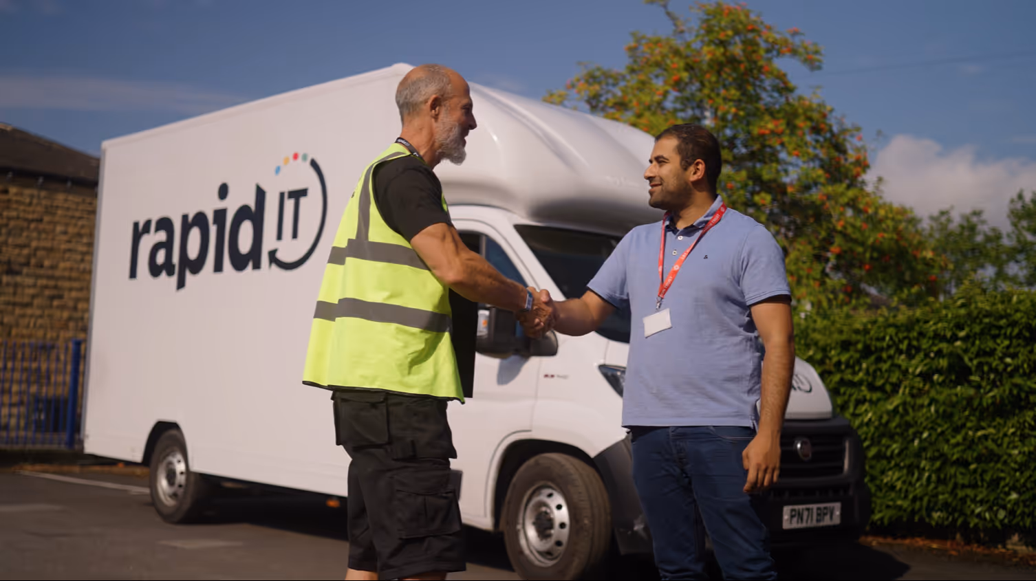 Rapid IT driver shaking hands with customer during secure IT recycling collection