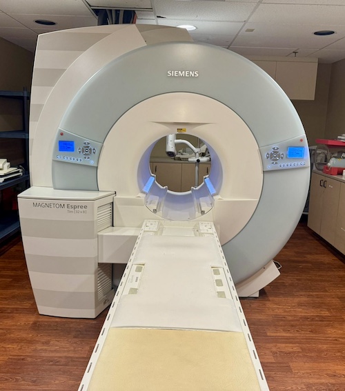 Siemens MAGNETOM Espree MRI machine in a clinical imaging room.