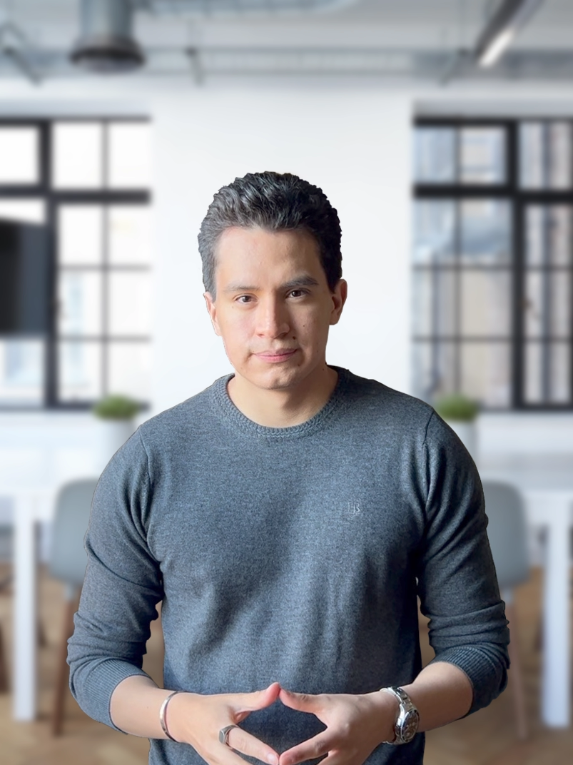 John Orman looking into the camera with a board room in the background