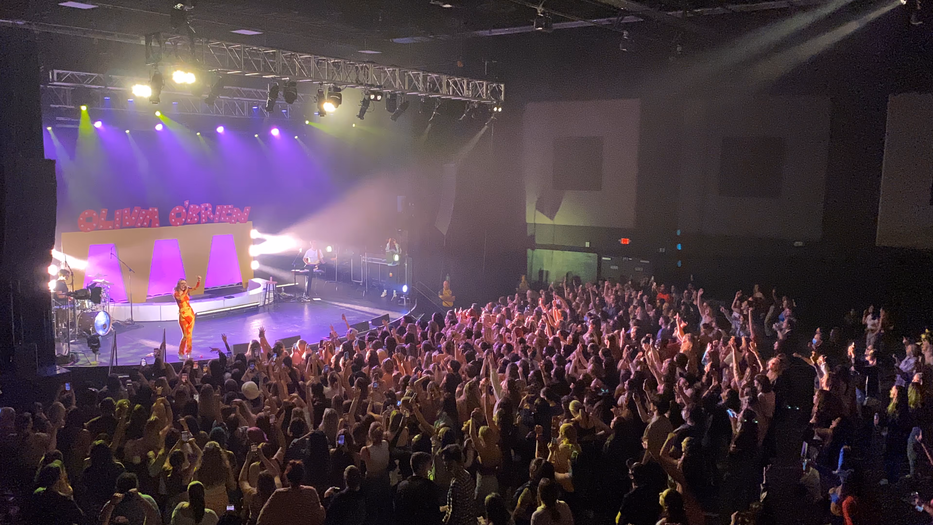 Olivia O'brien performing from stage