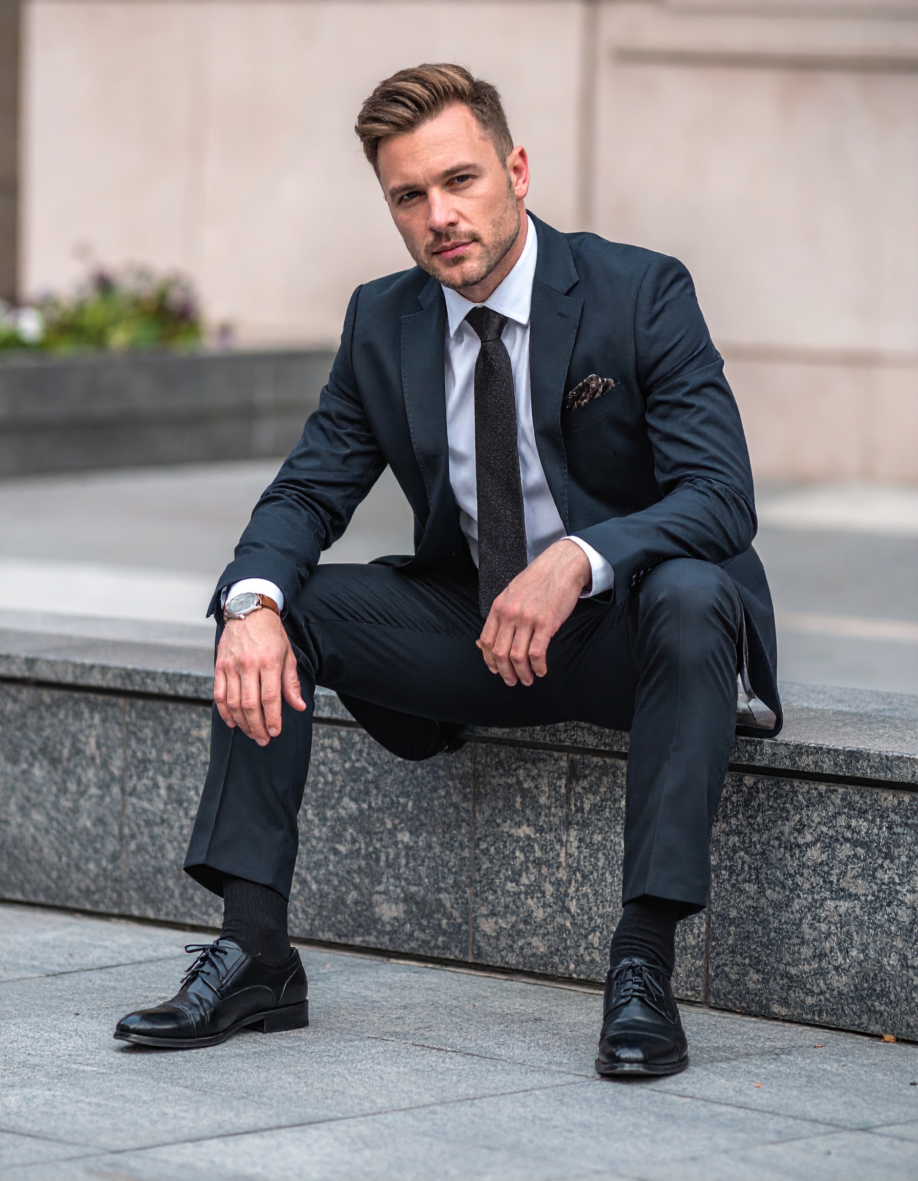 Man sitting with Alistair Grey Shoes on.