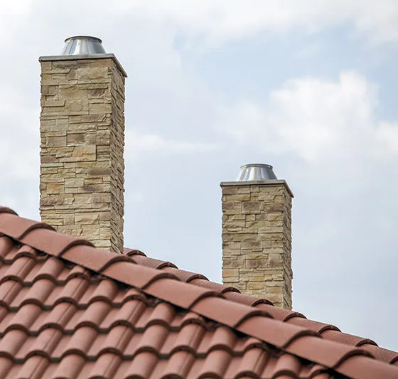 a roof with a couple of chimneys