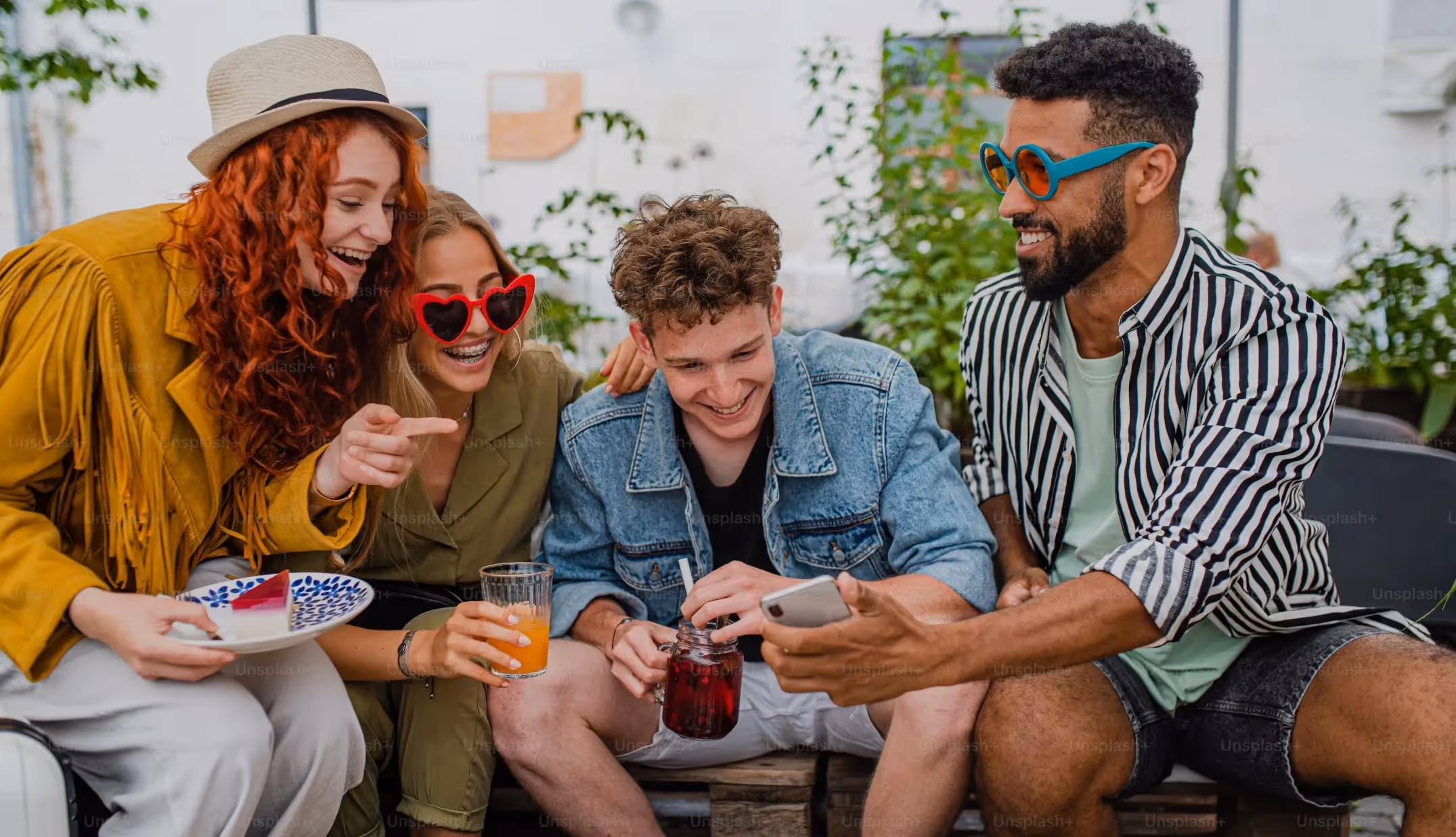 Friends at lunch looking at phone