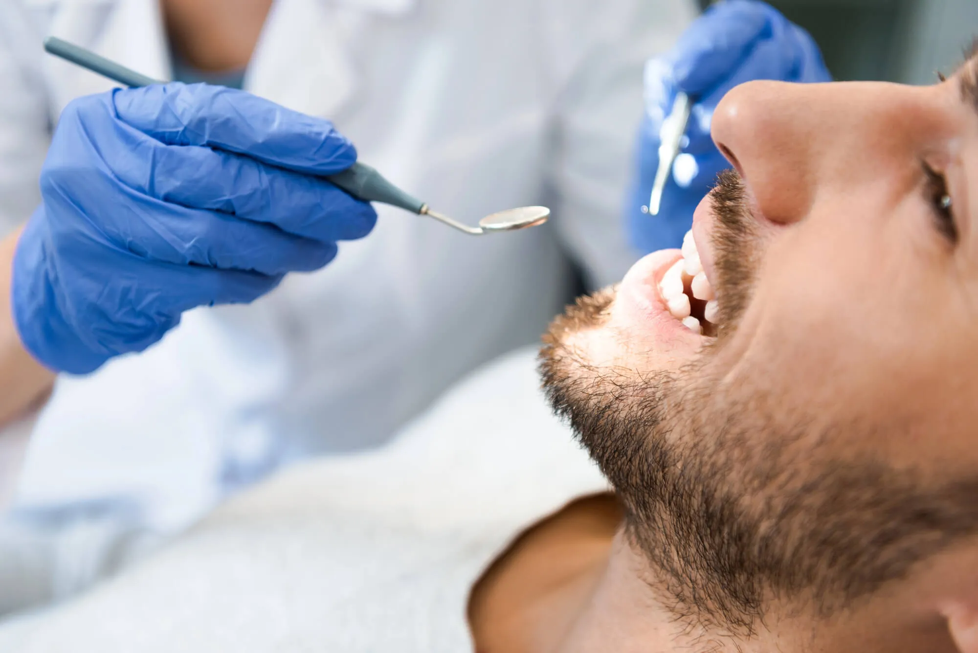 dentist spartanburg sc checking patient's teeth