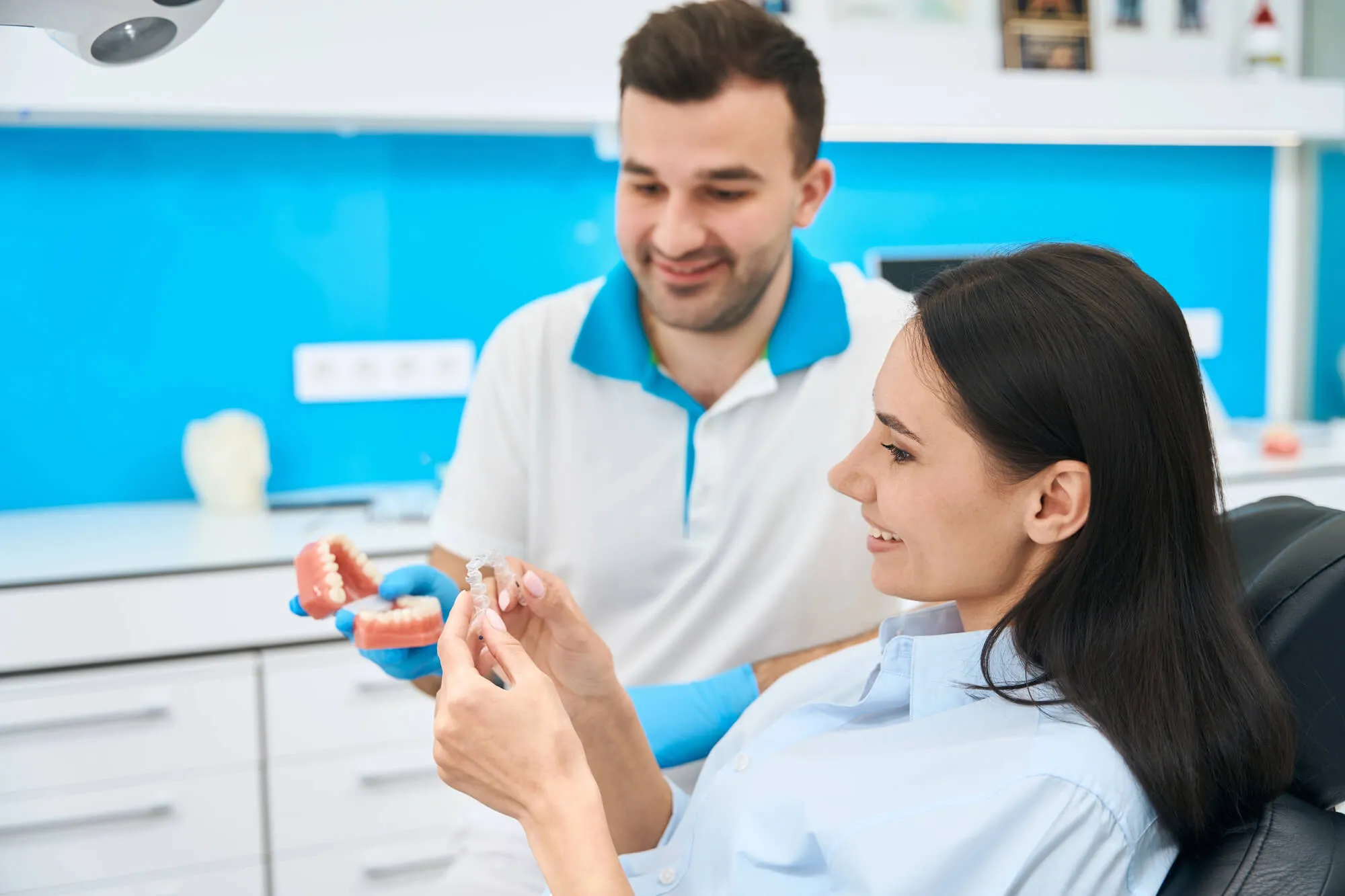 dentist showing patient her new affordable dentures spartanburg sc