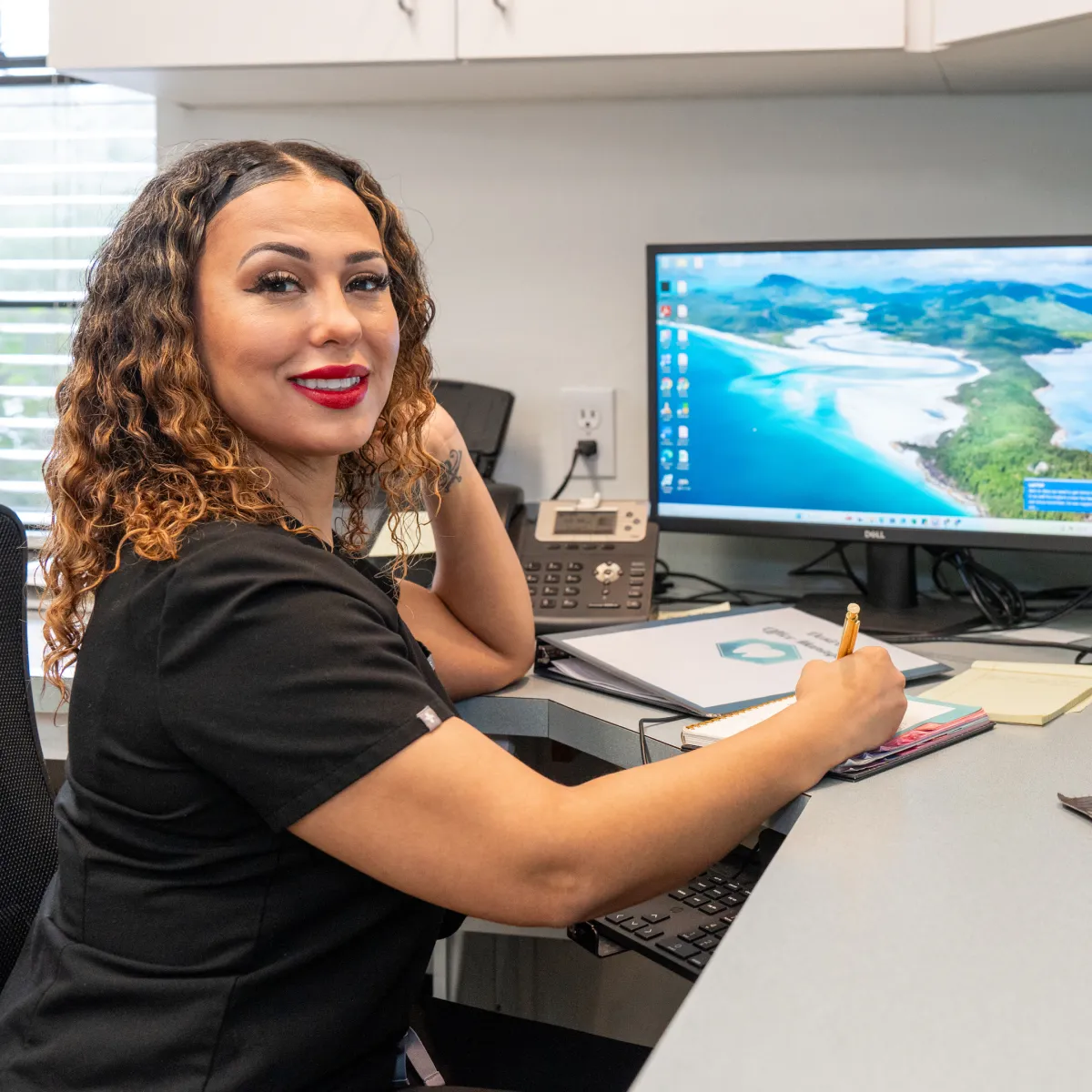 Comprehensive Dental Care team member at front desk