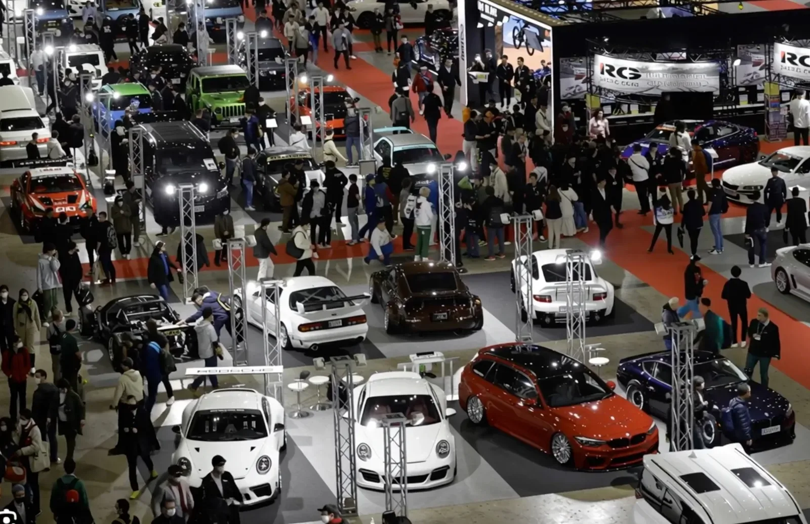 Custom cars and visitors filling the Tokyo Auto Salon exhibition hall
