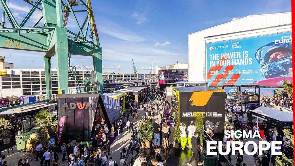 Crowds and exhibitor stands at a SiGMA industry exhibition
