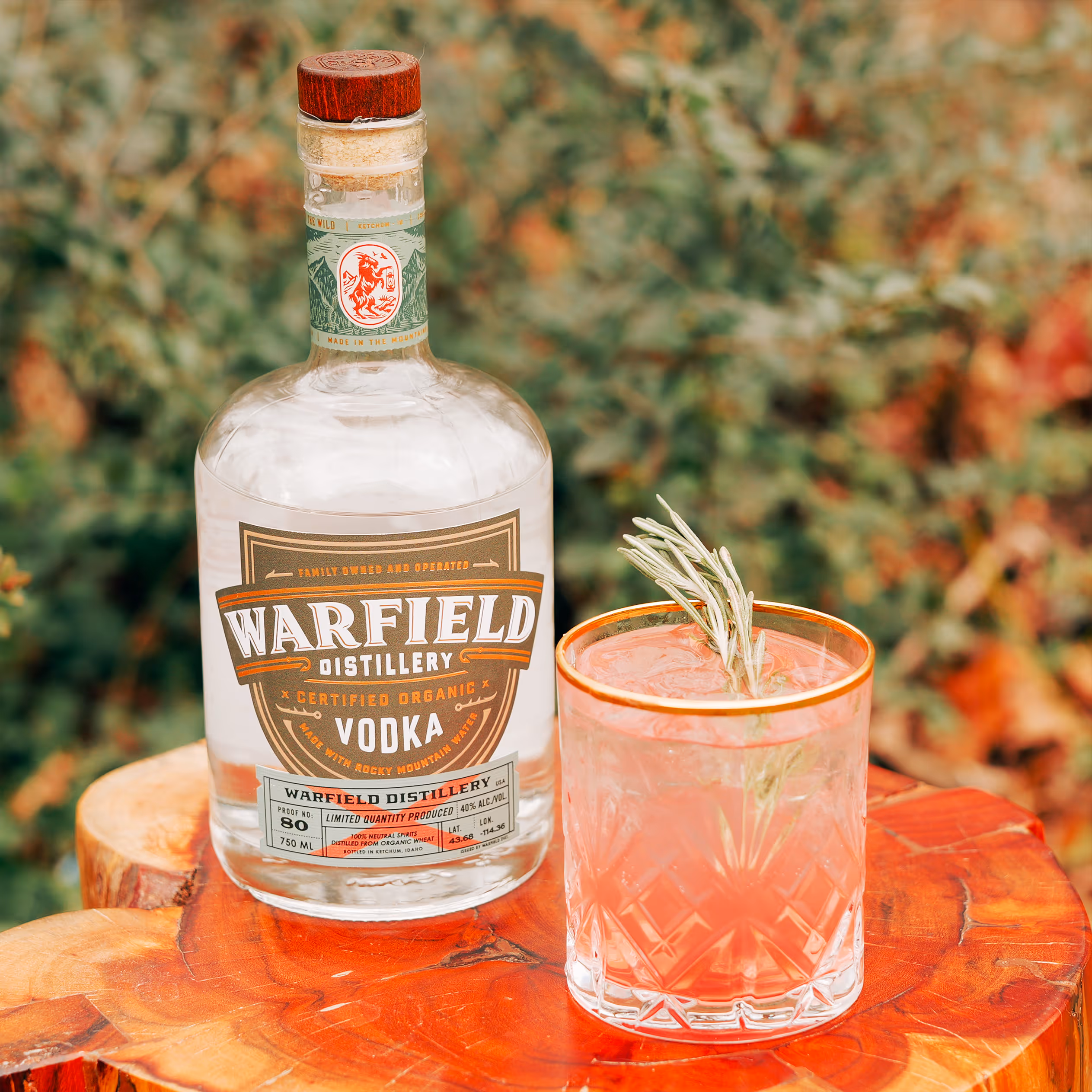 Vodka bottle behind cocktail