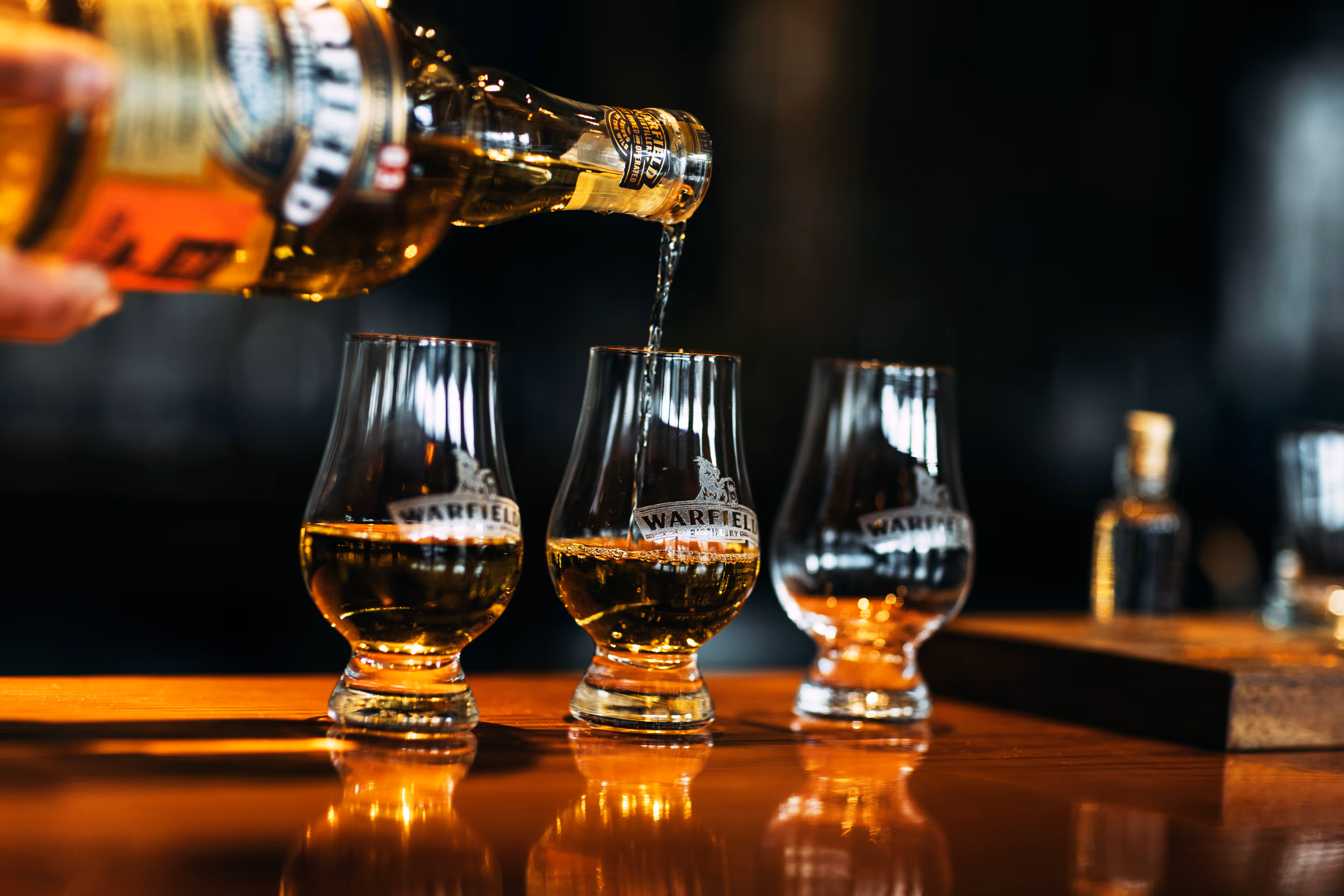 Whiskey being poured into glasses