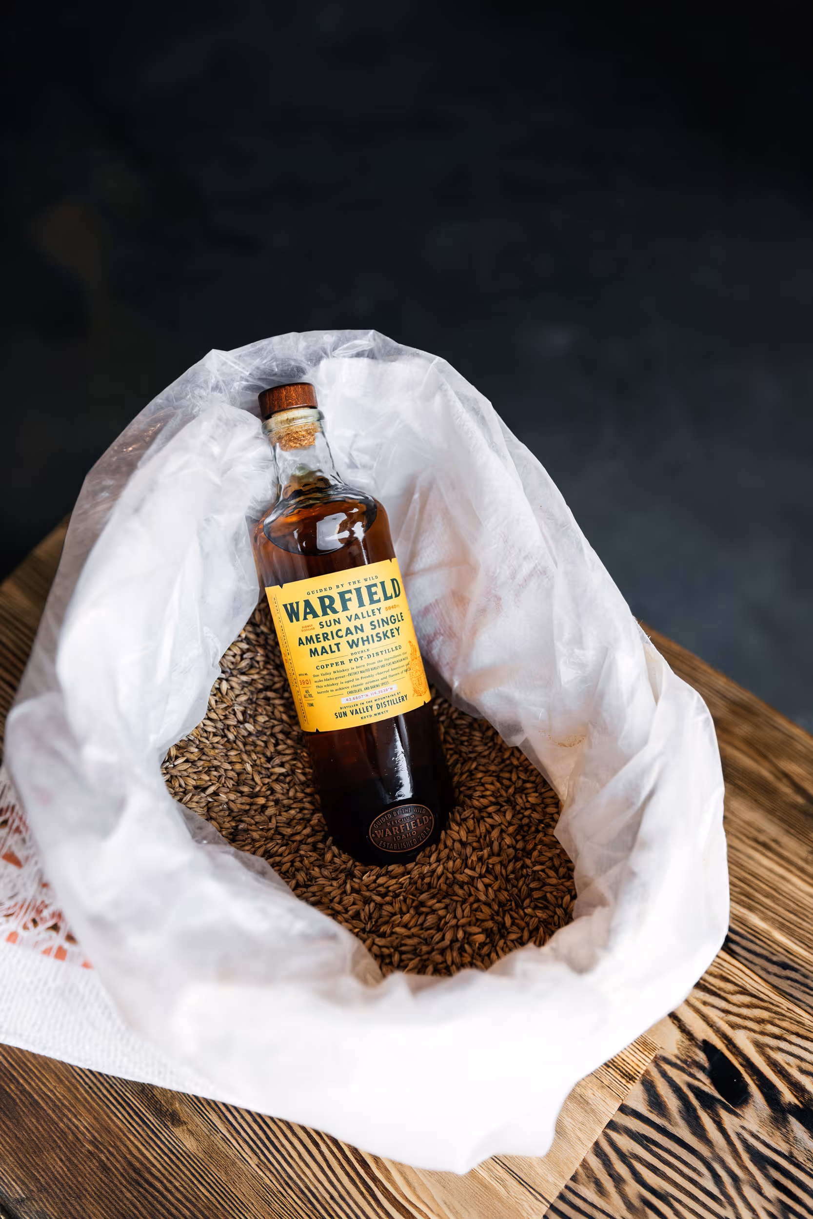 Whiskey Bottle on wood
