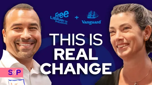 Smiling man and woman with text 'This is real change' and logos of Free Library of Philadelphia and Vanguard on a dark blue background.