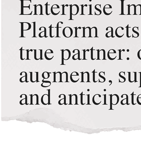 Partial view of a printed text excerpt mentioning 'Enterprise Im...', 'Platform acts', and 'true partner: ... augments, sup... and anticipate'.