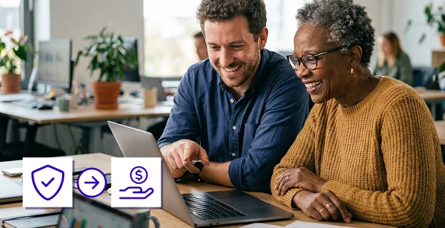 Smiling man and woman looking at a laptop together at a desk in an office setting, with icons of a shield and hand with coin indicating secure payment.