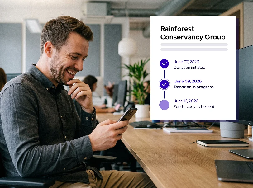 Man smiling at his phone at a desk with a digital overlay showing a donation progress timeline for Rainforest Conservancy Group.