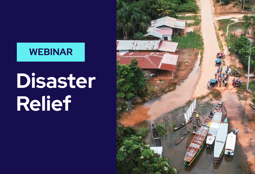 Aerial view of a flooded village with boats and people gathered on a muddy road; text on a blue background reads Webinar: Disaster Relief.