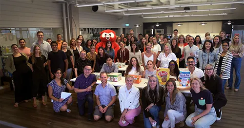 Hootsuite employees gathered for a large group volunteer event with food donations.