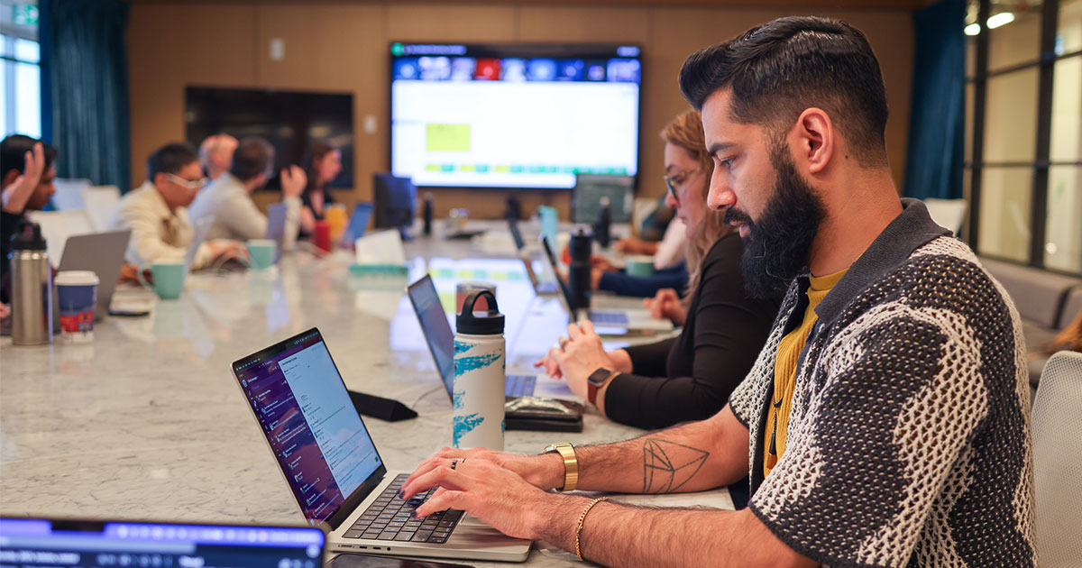 Employees together working on a group effort project