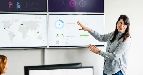 Woman presenting data in a meeting