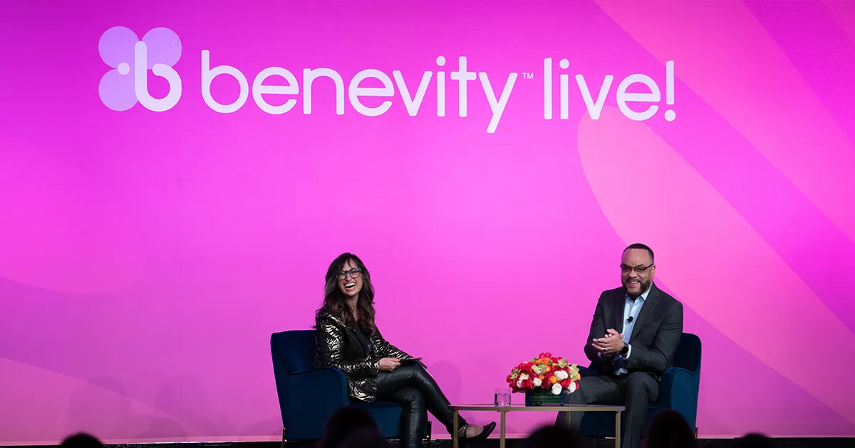 Benevity's Sona Khosla and Cisco's Bryan Tippens sharing a moment on stage at Benevity Live!
