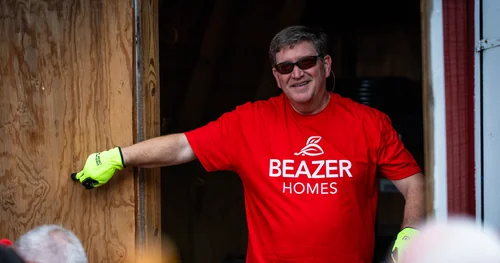 Beazer Homes employee smiles while volunteering