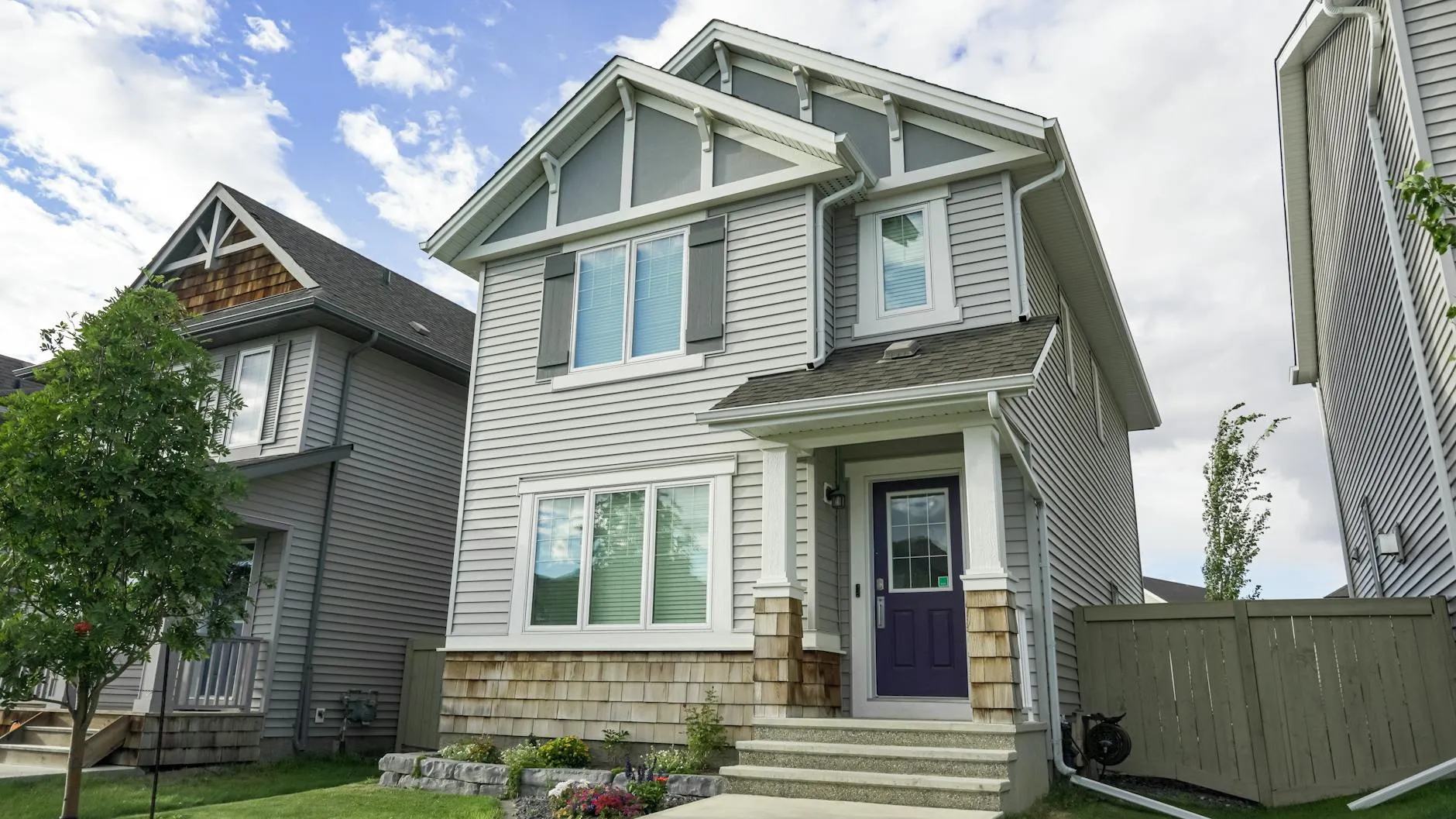 Newer two-storey detached family home with a covered front entry