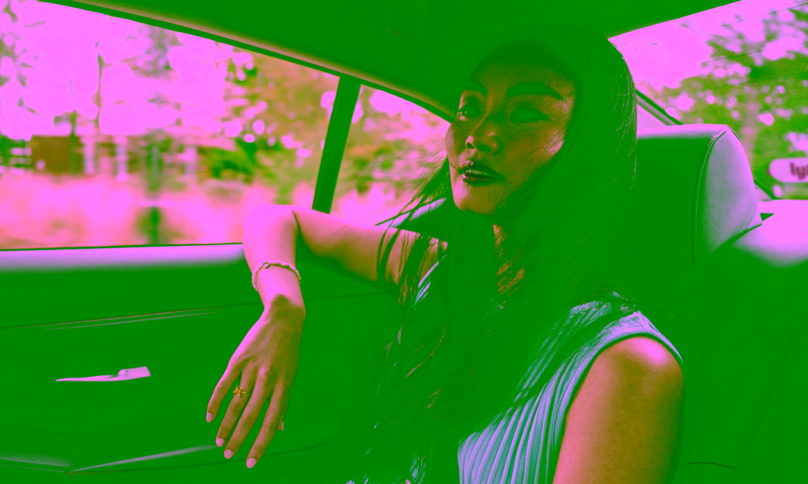 girl riding in the back of a Lyft car