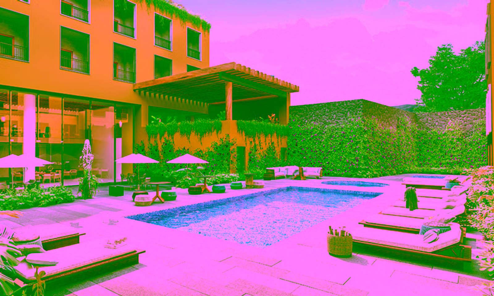 pool with lounge chairs at a hotel