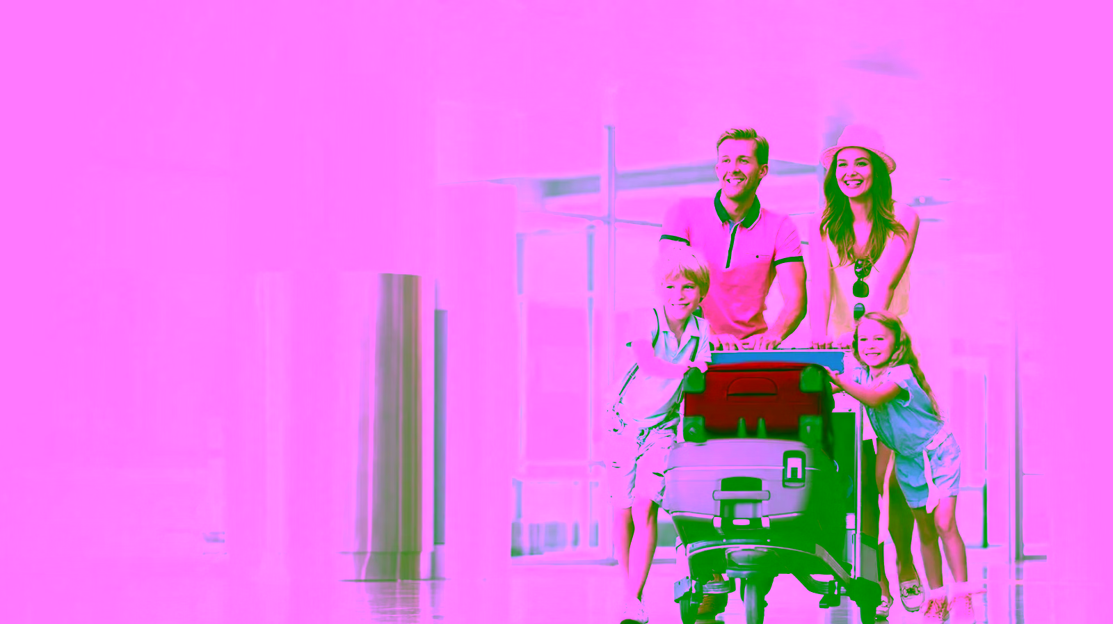 family of 4 with mom, day, son, and daughter pushing a luggage cart in an airport