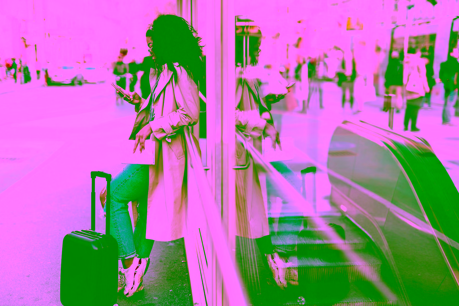 girl on a london street with a suitcase looking at her phone for flight deals with dailydrop pro