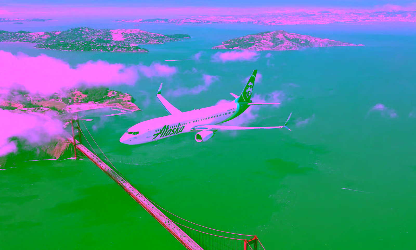 Alaska airlines plane flying over the Golden Gate Bridge