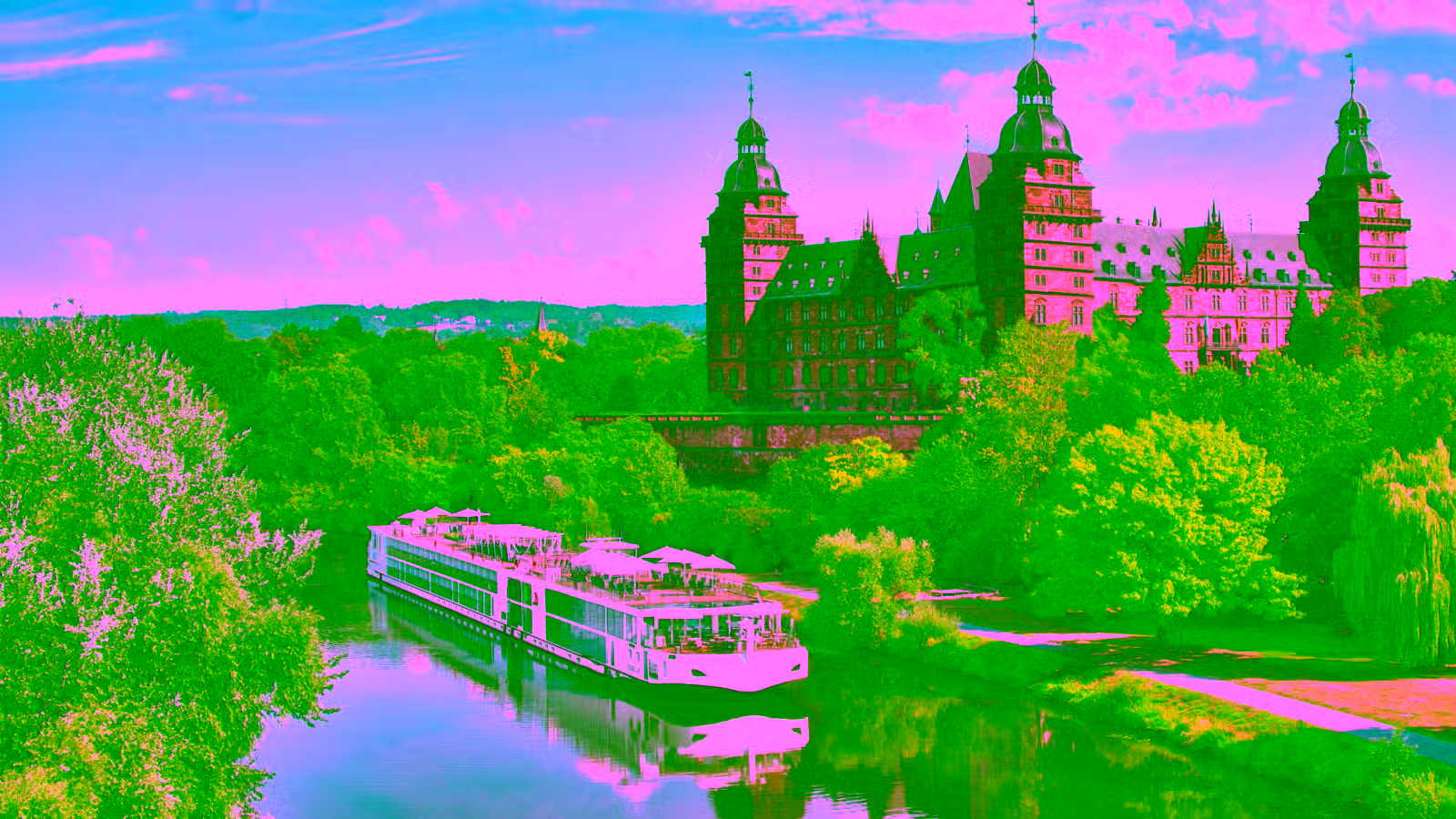 river cruise boat passing a castle