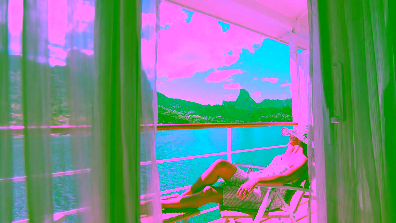 women sunbathing on a Paul Gauguin Cruise private balcony 