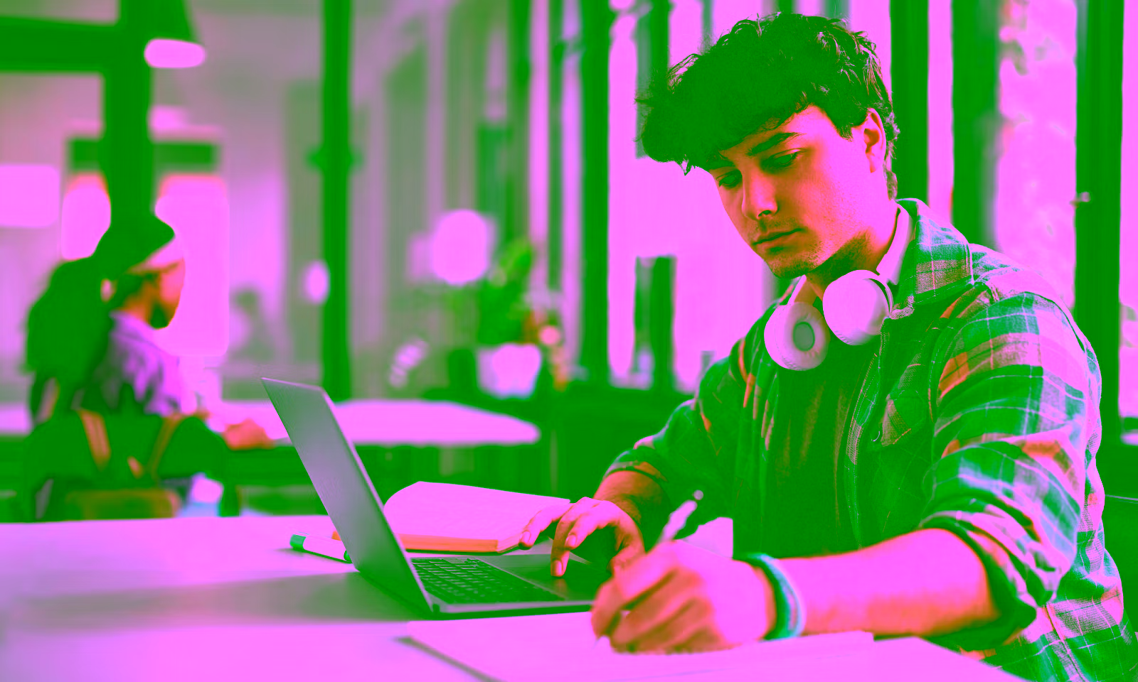 student studying and taking notes